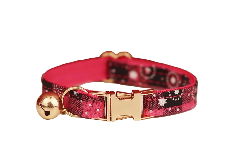 cat  collar with red and black pattern and gold buckle 