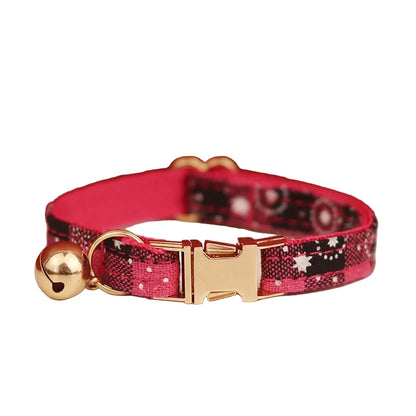 Pink and black patterned cat collar with gold buckle and bell 